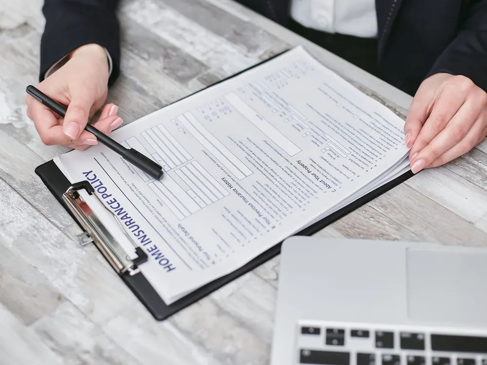 Reviewing a home insurance policy and claim documentation